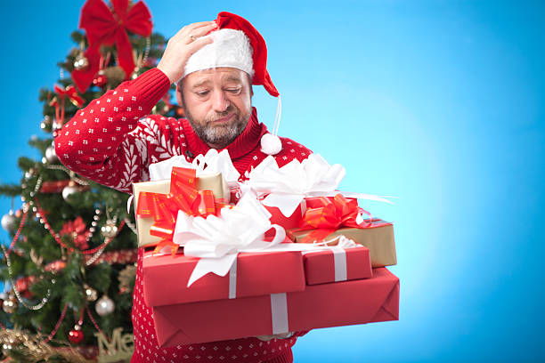 istock Mature man by christmas tree. 174799339