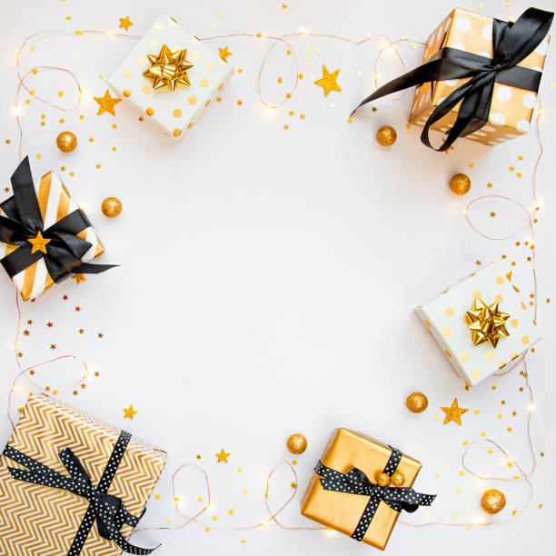 istock Top view of gift boxes in various black, white and golden designs. Flat lay, copy space. A concept of Christmas, New Year, birthday celebration event. 1747994511