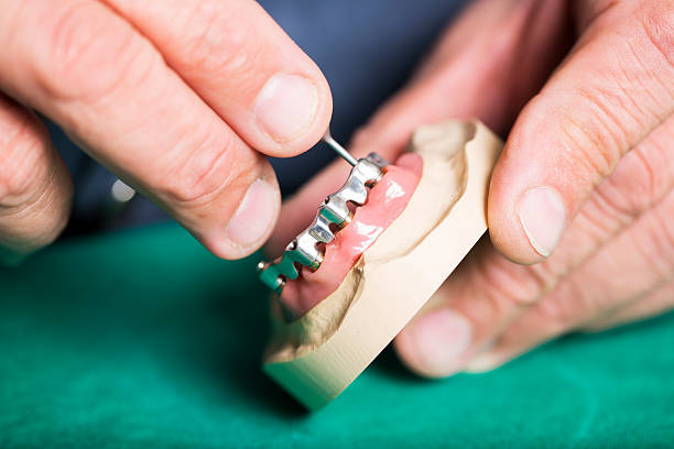 istock Dental implant.....Dental technician is prepairing dentures for dentist 174799494