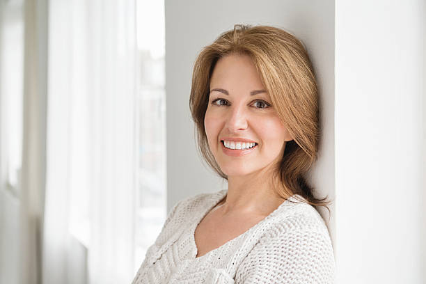 istock Mature Woman In Sweater Leaning Against Wall 174799498