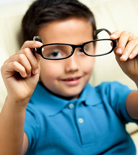 istock Little boy showing his eyeglasses 174799638