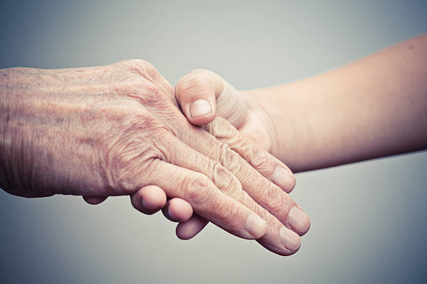 istock Elderly hand and caregiver 174799934