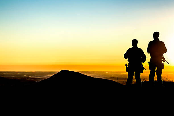 istock Army Soldiers on a Hilltop at Sunset 174800195