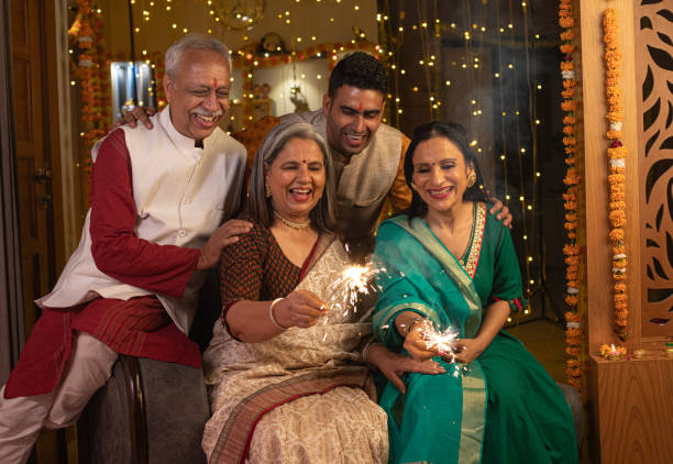 istock Two generation family burning sparklers at home during Diwali 1748002276