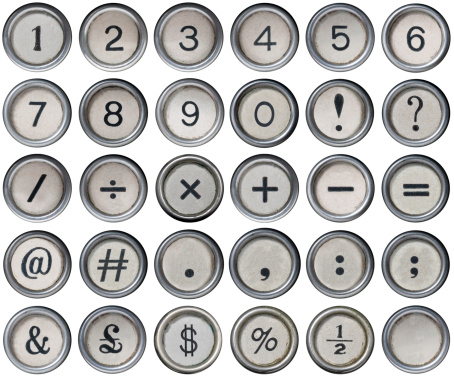 Antique typewriter numerical and punctuation keys isolated on a white background, lined up with precision to ensure easy cut-out.