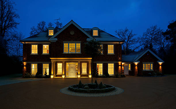 beautiful luxury home at dusk "an external view of a beautiful mansion house at dusk with all lights turned on for the image. Taken during the winter months, the scene is quite frosty. A large circular carriage drive sits in the foreground.Looking for exterior views of Luxury Homes and Buildings... then please see my other images by clicking on the lightbox Link below...A>A" gable photos stock pictures, royalty-free photos & images
