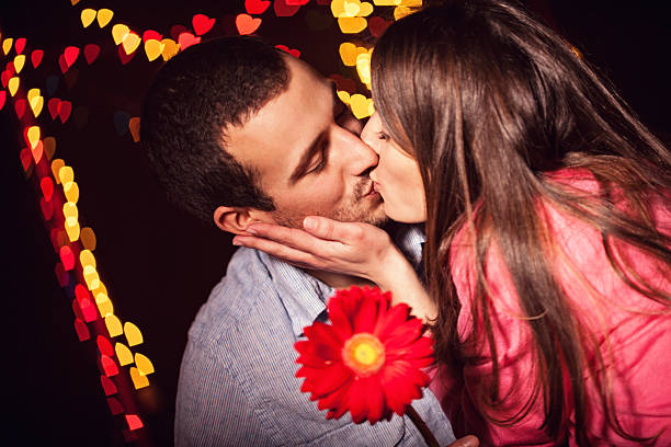 Kiss And A Flower Stock Photo - Download Image Now - Adult, Adults