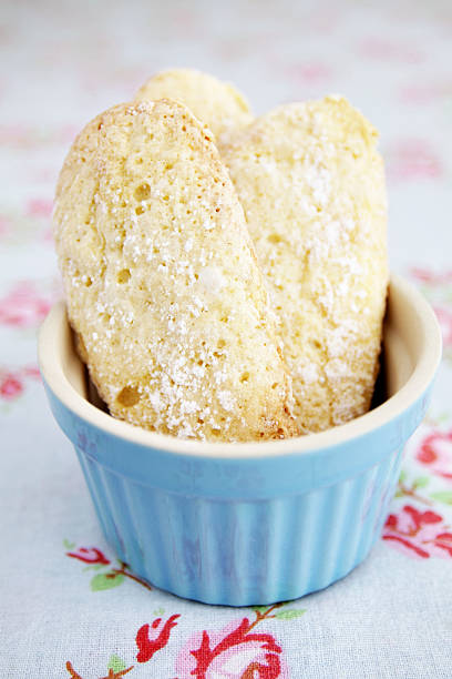 istock Ladyfingers homemade in a blue bowl on flower pattern tablecloth 174801812