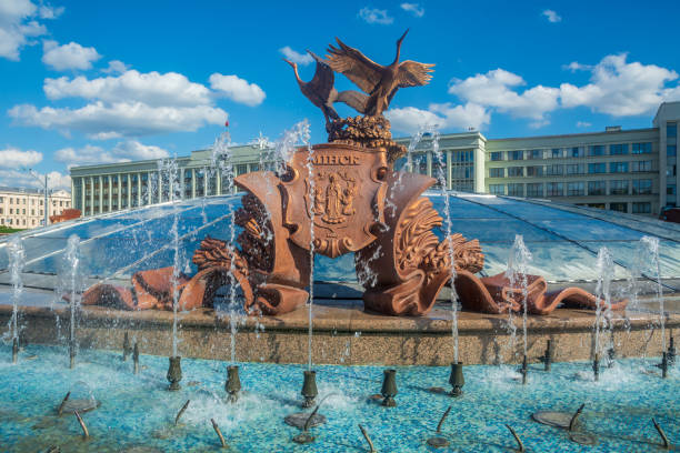 fountain . Sculpture of cranes fountain in Independence Square against the background of a blue sky with clouds Minsk , Belarus. belarus stock pictures, royalty-free photos & images