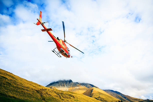 istock red helicopter in the swiss alps 174802263
