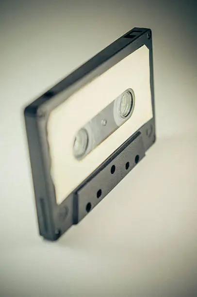 Vintage compact cassette. Toned image and added grain.