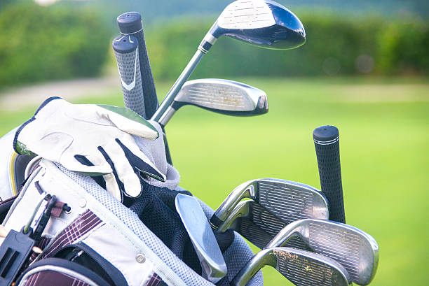 istock golfclubs golfbag on driving-range fairway 174802539