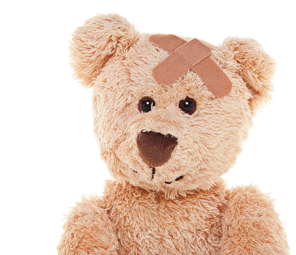 istock Suffering Injured Sweet Teddy Bear with Bandage 174802753