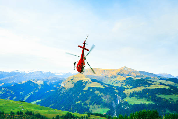 istock red helicopter in the swiss alps 174802792