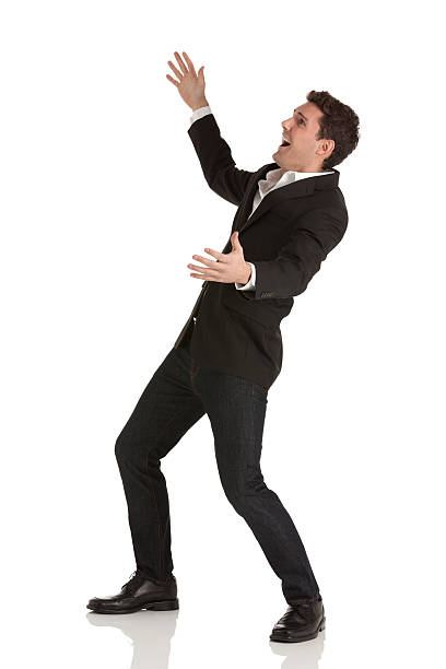istock Excited young businessman with arms outstretched 174803035