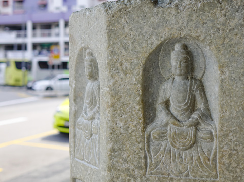Small Buddha statues at ancient Buddhist pagoda in Chinatown, Singapore. Buddhism first appeared around the Singapore Straits during the 2nd century.