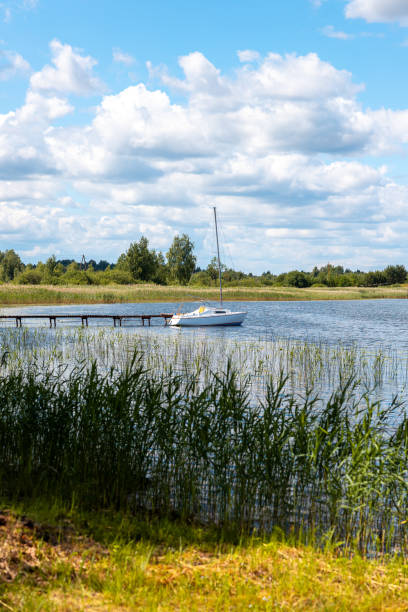 istock Sailing boat at the pier in the lake 1748036243