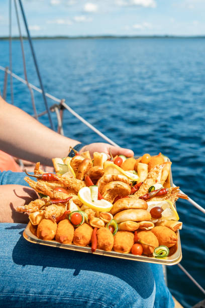 istock Prawns or shrimp on a plate at edge of beautiful Mediterranean beach 1748036318