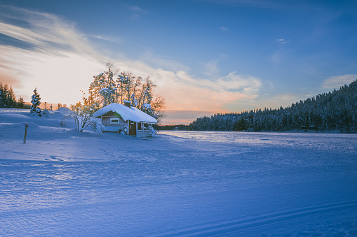 A house by frozen lake in Fins Lapland