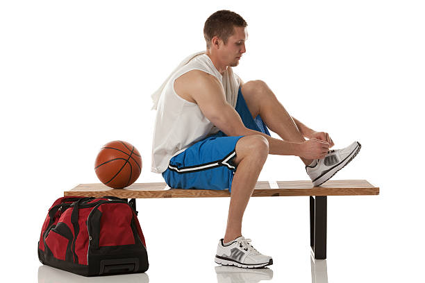 istock Basketball player tying his shoes. 174804129