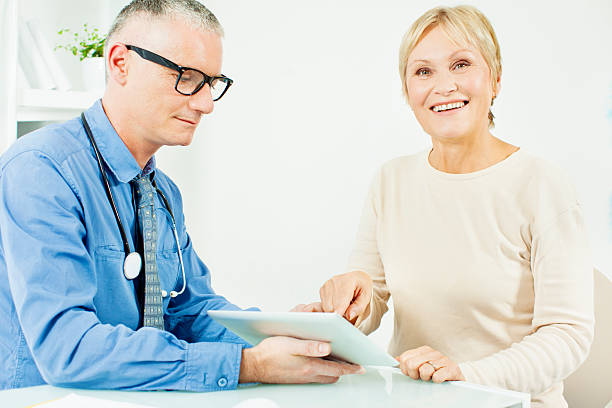 istock Mature Woman At Doctors Office 174804433