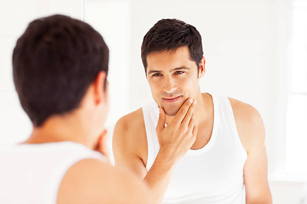 istock A man staring himself in the mirror 174804518