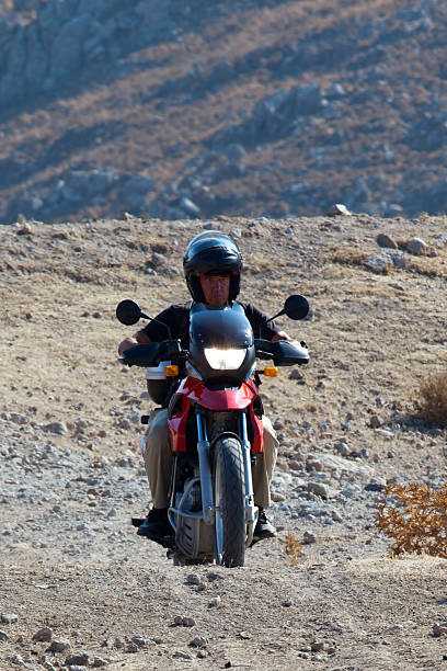 istock Rider with red motorcycle on off-road 174804676