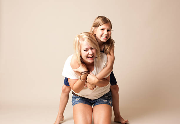Young Girl Hugging on her Mother