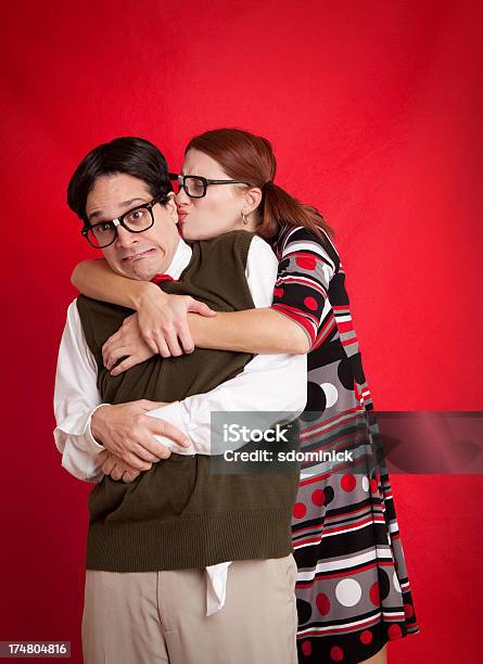 Nerdy Woman Attacking Nerd With An Awkward Kiss Stock Photo - Download Image Now - Couple - Relationship, Humor, 35-39 Years