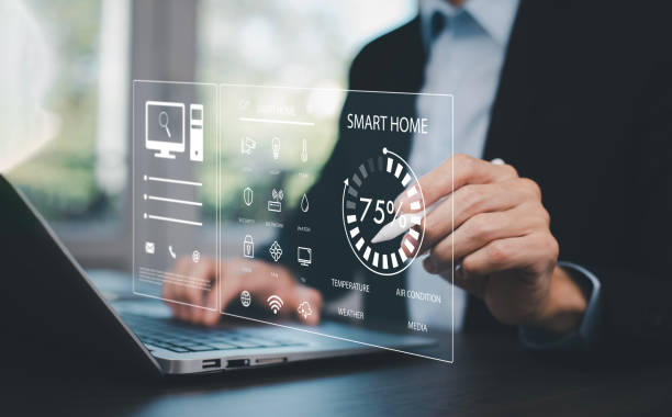 istock Hand using AI smart tablet with smart home app on the room, circular interface of the smart home automation assistant on the virtual screen and user touches the button, smart home digital interface 1748049817