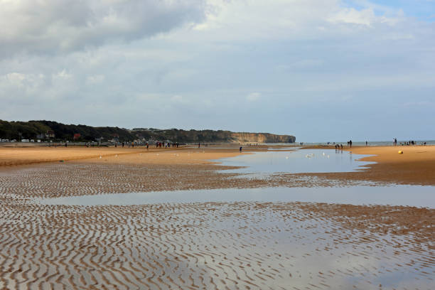 istock beach with water after summer storm and people in the background 1748050328