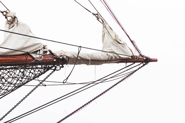 Spinnaker with uphaul on sail boat, blue sky in background. Marine sailing objects concept.