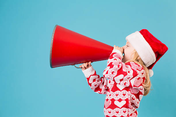 istock Santa's Little Helper Making Announcement With Megaphone 174805317