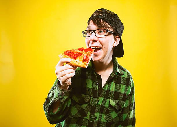istock Pizza Eating Teenage Guy 174805455