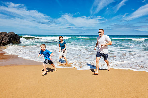 istock Family of Three Playing on The Beach 174805721
