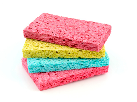 Colored sponges isolated on white background .