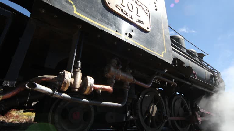 Old steam train stoping at the train station