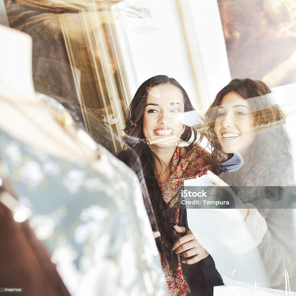 Woman shopping for clothes. Looking at a window-shop. More files of this model and series on port. Made with professional make-up. Square format. Window Shopping Stock Photo