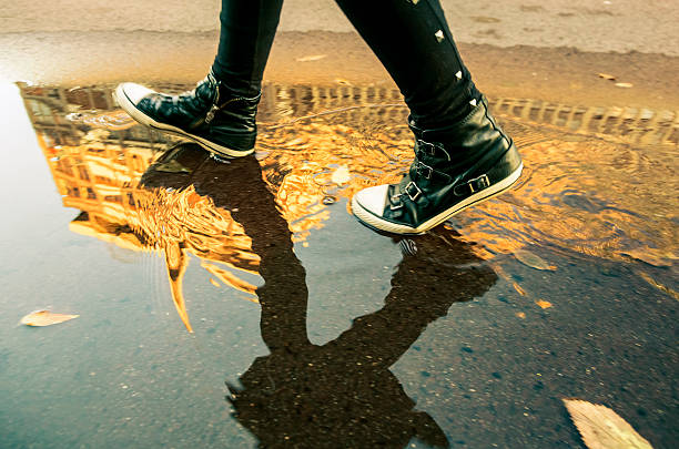 istock Woman walking outdoor after a rainfall 174807469