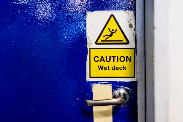 istock Wet floor warning sign posted on a ship's door 1748079380