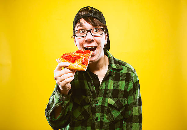 istock Pizza Eating Teenage Guy 174808106