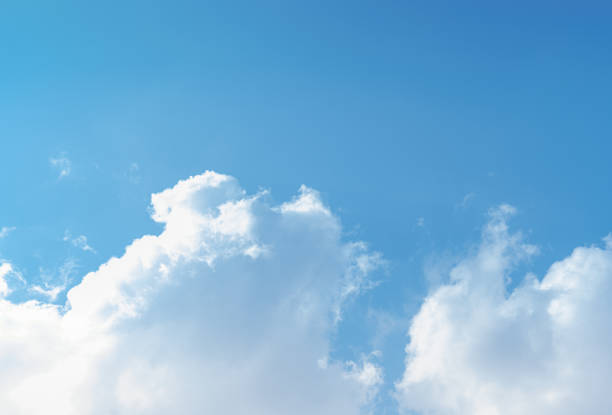 istock Blue sky and white clouds float in the sky on a clear day with warm sunlight. The sky was clear in the calm sunshine. Bright winter weather background. 1748083665