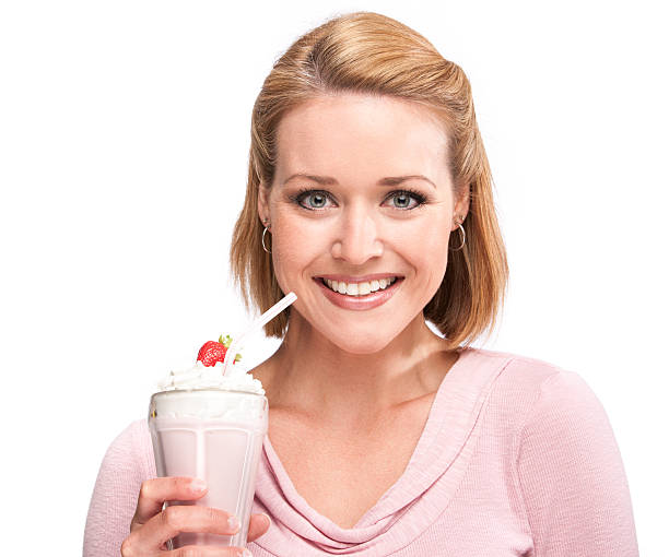 istock Beautiful Woman with Milkshake 174808552