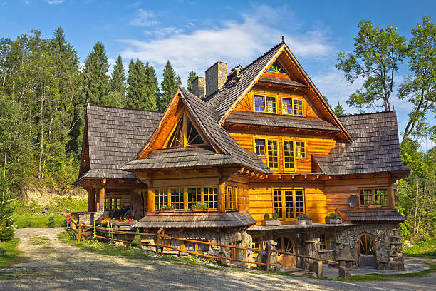 Wooden residential House "Woden residential House with wood shinge roof in Tatra Mountains, Malopolskie province, PolandSee more RESIDENTIAL HOMES images here:" zakopane stock pictures, royalty-free photos & images