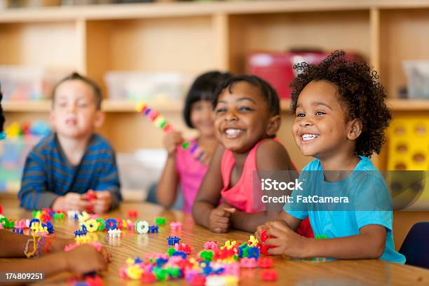 Teacher With Diverse Group Of Preschool Children Stock Photo - Download Image Now - 2-3 Years, African Ethnicity, African-American Ethnicity