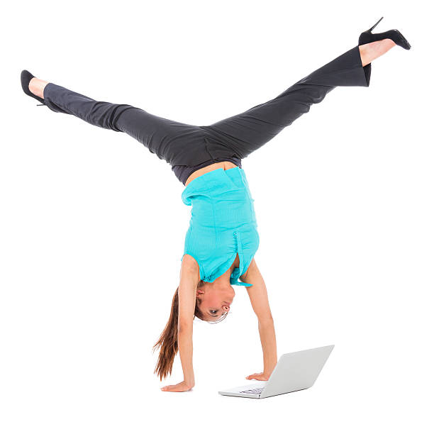 istock woman high heels handstand laptop 174809451