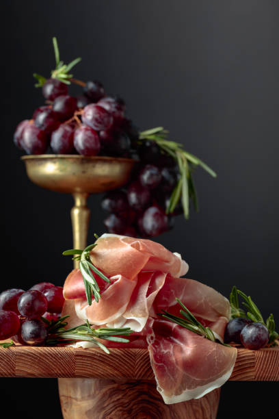 Prosciutto with grapes and rosemary.