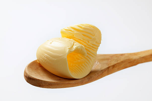 istock Butter curl on a wooden spoon 174809811