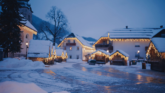 Snowy alpine village Kranjska gora in winter time with illuminated Christmas market decoration