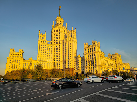 Moscow, Russia - September, 27, 2023: Stalin high-rise on Kotelnicheskaya embankment. This is historic city center of Moscow. Golden sunset light on a high-rise building. Beautiful evening in the city